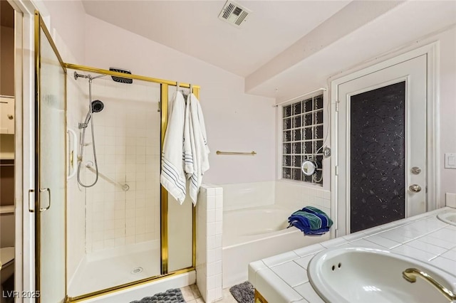 1905 Dakota Hills Ave, Las Vegas, NV 89123 - full bathroom featuring a shower stall, a bath, and double vanity