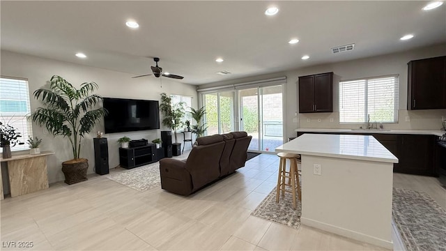 2924 Sunday Silence Rd, North Las Vegas, NV 89086 - living room with recessed lighting, a ceiling fan, healthy amount of natural light, and light tile patterned floors