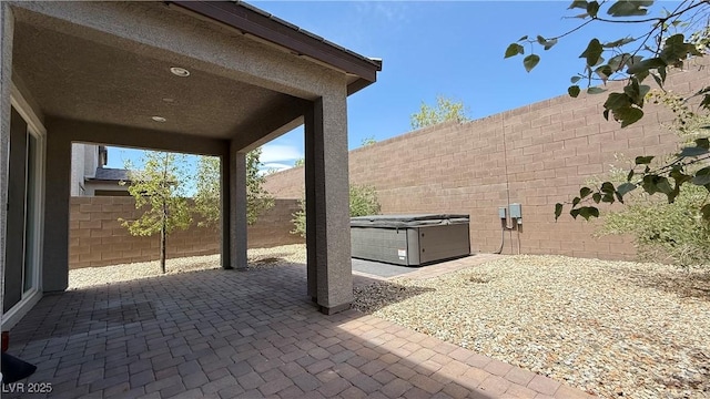 2924 Sunday Silence Rd, North Las Vegas, NV 89086 - fenced backyard with a patio, a hot tub, and central AC unit
