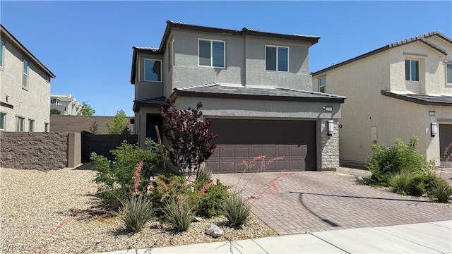 2924 Sunday Silence Rd, North Las Vegas, NV 89086 - traditional home featuring a garage, stucco siding, and decorative driveway