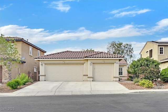 4020 Recktenwall Ave, North Las Vegas, NV 89081 - mediterranean / spanish-style house with a tiled roof, driveway, stucco siding, and a garage
