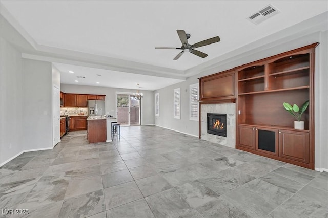 4020 Recktenwall Ave, North Las Vegas, NV 89081 - unfurnished living room featuring baseboards, a chandelier, a ceiling fan, a premium fireplace, and recessed lighting