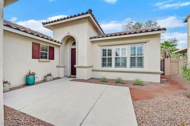 4020 Recktenwall Ave, North Las Vegas, NV 89081 - mediterranean / spanish home with a tiled roof, stucco siding, and a patio area