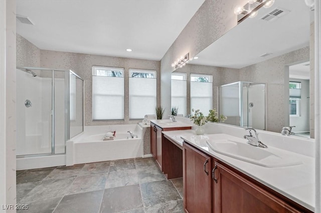 4020 Recktenwall Ave, North Las Vegas, NV 89081 - full bath featuring vanity, a stall shower, a bath, wallpapered walls, and stone finish floors