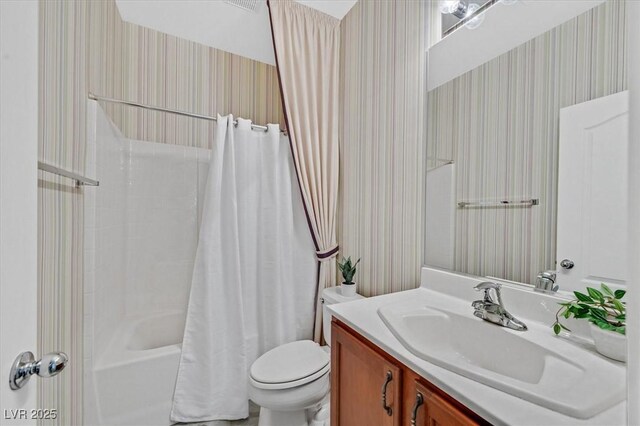 4020 Recktenwall Ave, North Las Vegas, NV 89081 - bathroom featuring wallpapered walls, vanity, toilet, and shower / tub combo