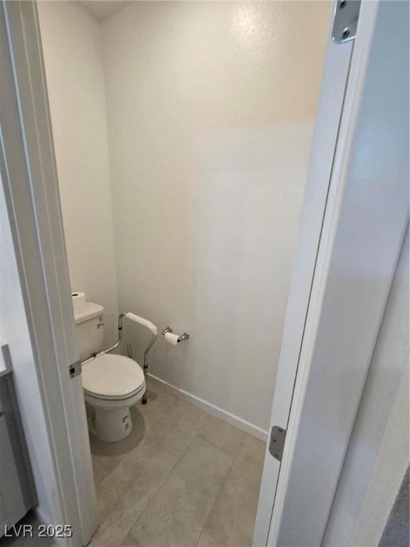 289 Aravalli Crest St, Henderson, NV 89015 - bathroom featuring toilet, baseboards, and tile patterned floors