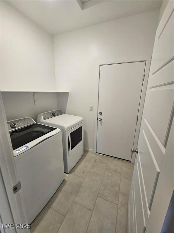289 Aravalli Crest St, Henderson, NV 89015 - laundry area featuring washing machine and dryer and light tile patterned floors
