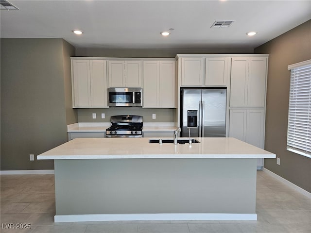 289 Aravalli Crest St, Henderson, NV 89015 - kitchen featuring appliances with stainless steel finishes, a sink, a center island with sink, recessed lighting, and light countertops