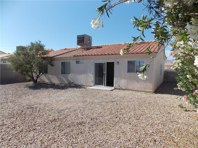 319 Mulberry Glen Dr, North Las Vegas, NV 89031 - rear view of property with stucco siding, a tile roof, and cooling unit