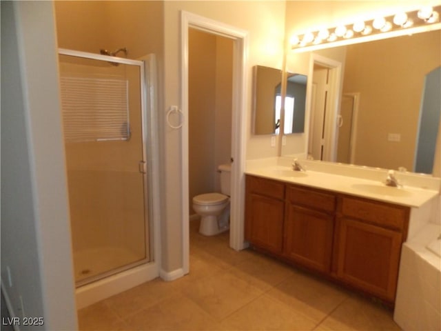 319 Mulberry Glen Dr, North Las Vegas, NV 89031 - full bath featuring a stall shower, toilet, tile patterned flooring, and double vanity