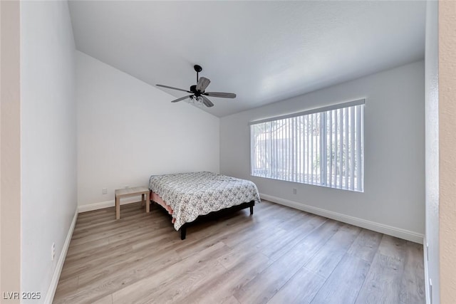 5639 Guiding Star Cir, North Las Vegas, NV 89031 - bedroom featuring wood finished floors, vaulted ceiling, and ceiling fan