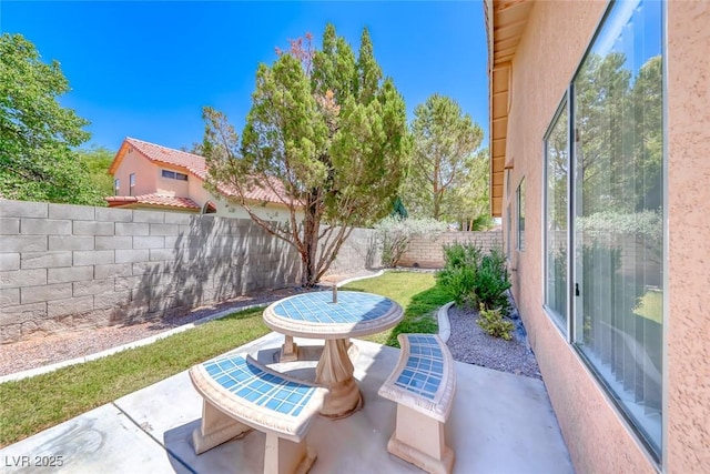 5639 Guiding Star Cir, North Las Vegas, NV 89031 - fenced backyard with a patio
