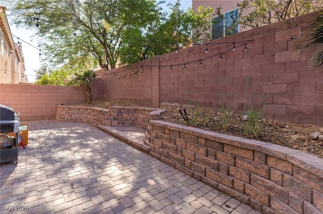6714 Flamenco Ct, Las Vegas, NV 89139 - fenced backyard featuring a patio and area for grilling
