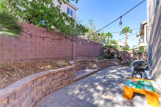 6714 Flamenco Ct, Las Vegas, NV 89139 - fenced backyard featuring a grill and a patio area