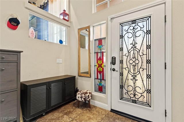 6714 Flamenco Ct, Las Vegas, NV 89139 - foyer entrance featuring tile patterned floors and a high ceiling
