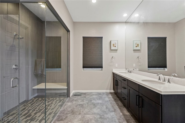 11672 Barga Ct, Las Vegas, NV 89138 - bathroom with double vanity, recessed lighting, a stall shower, and baseboards