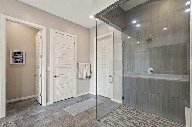 11672 Barga Ct, Las Vegas, NV 89138 - bathroom featuring a stall shower and baseboards