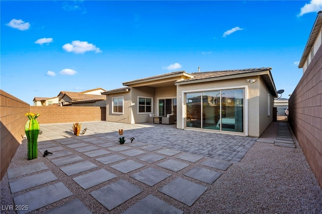 11672 Barga Ct, Las Vegas, NV 89138 - back of house featuring stucco siding, a patio area, and a fenced backyard