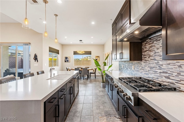 11672 Barga Ct, Las Vegas, NV 89138 - kitchen featuring range hood, a sink, stainless steel appliances, light countertops, and recessed lighting