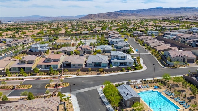 11672 Barga Ct, Las Vegas, NV 89138 - aerial perspective of suburban area featuring a mountainous background and a pool area