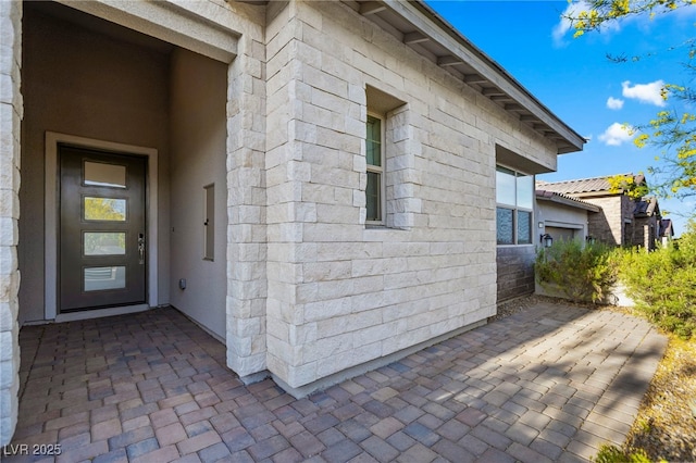 11672 Barga Ct, Las Vegas, NV 89138 - doorway to property featuring a patio and stucco siding