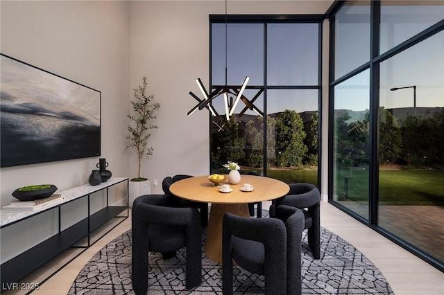 10781 Agate Cliffs Ave, Las Vegas, NV 89135 - dining area featuring light wood-style flooring and floor to ceiling windows