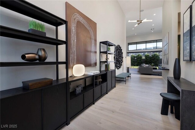 10781 Agate Cliffs Ave, Las Vegas, NV 89135 - corridor with light wood-style floors and recessed lighting