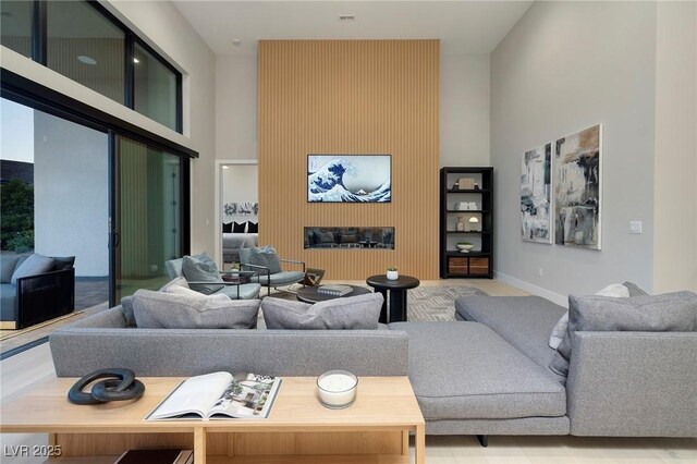 10781 Agate Cliffs Ave, Las Vegas, NV 89135 - living area with a towering ceiling and baseboards