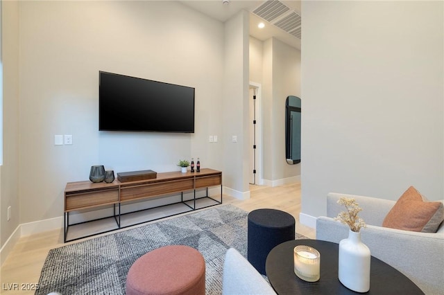 10781 Agate Cliffs Ave, Las Vegas, NV 89135 - living room featuring wood finished floors, baseboards, and recessed lighting