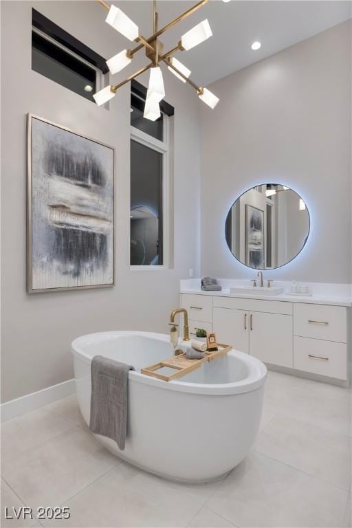 10781 Agate Cliffs Ave, Las Vegas, NV 89135 - full bath with a freestanding bath, tile patterned floors, vanity, and baseboards