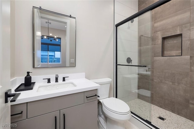 10781 Agate Cliffs Ave, Las Vegas, NV 89135 - bathroom with toilet, vanity, a stall shower, and a baseboard heating unit