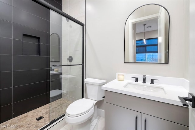 10781 Agate Cliffs Ave, Las Vegas, NV 89135 - full bathroom featuring toilet, vanity, and a stall shower