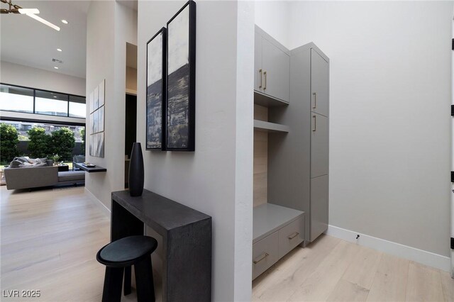 10781 Agate Cliffs Ave, Las Vegas, NV 89135 - mudroom with light wood-style floors, a high ceiling, baseboards, and recessed lighting