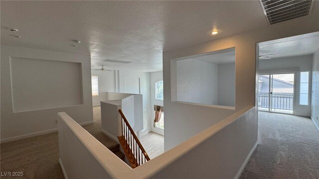 10066 Golden Bluff Ave, Las Vegas, NV 89148 - hallway featuring an upstairs landing, carpet floors, baseboards, and a textured ceiling