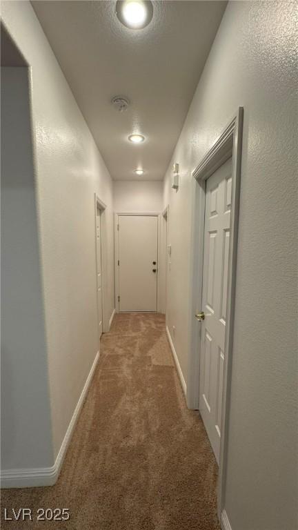 10066 Golden Bluff Ave, Las Vegas, NV 89148 - hallway with light colored carpet and baseboards