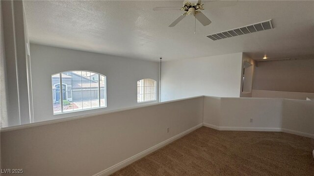 10066 Golden Bluff Ave, Las Vegas, NV 89148 - spare room featuring carpet flooring, a ceiling fan, baseboards, and a textured ceiling