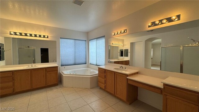 10066 Golden Bluff Ave, Las Vegas, NV 89148 - full bath with a stall shower, tile patterned flooring, a bath, and two vanities