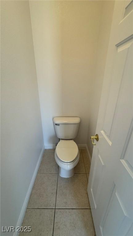 10066 Golden Bluff Ave, Las Vegas, NV 89148 - bathroom with tile patterned flooring, baseboards, and toilet