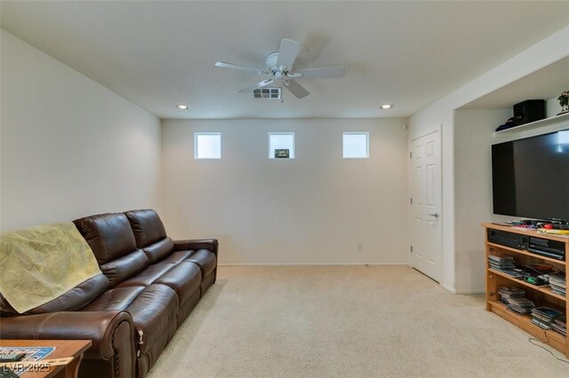 7645 Interlace St, Las Vegas, NV 89149 - living room featuring healthy amount of natural light, a ceiling fan, light colored carpet, baseboards, and recessed lighting