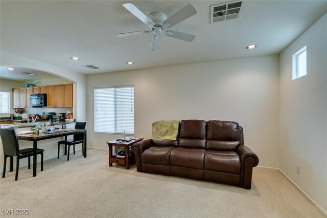 7645 Interlace St, Las Vegas, NV 89149 - living area with light colored carpet, a ceiling fan, recessed lighting, and baseboards