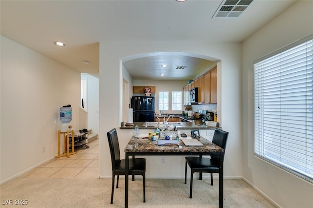 7645 Interlace St, Las Vegas, NV 89149 - dining room with arched walkways, light carpet, recessed lighting, and baseboards