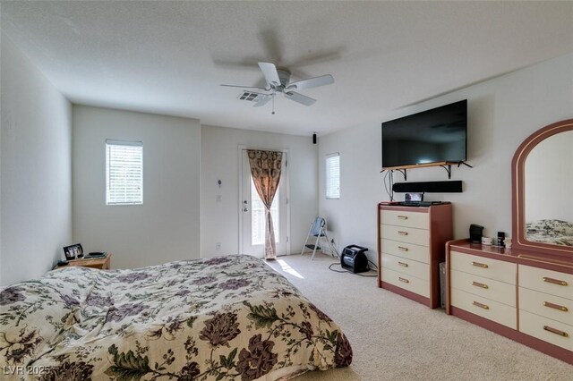 7645 Interlace St, Las Vegas, NV 89149 - bedroom with light carpet and a ceiling fan