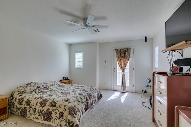 7645 Interlace St, Las Vegas, NV 89149 - bedroom featuring access to outside, light colored carpet, and a ceiling fan