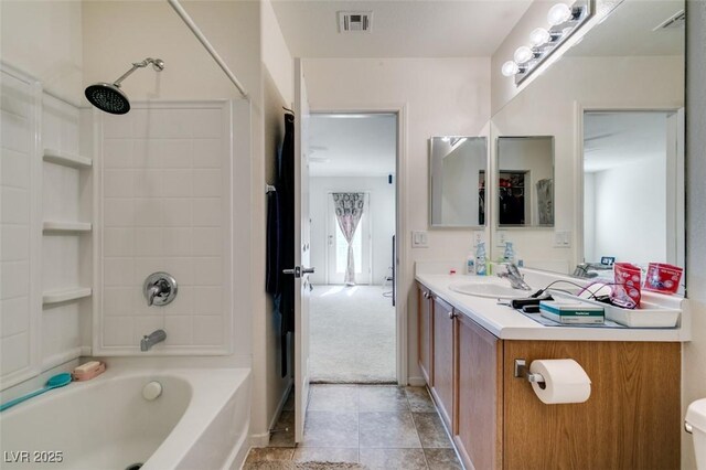7645 Interlace St, Las Vegas, NV 89149 - bathroom with vanity, shower / bathtub combination, toilet, and tile patterned flooring