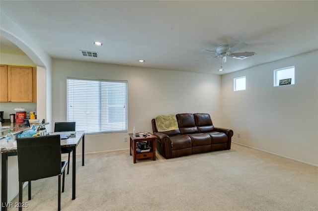 7645 Interlace St, Las Vegas, NV 89149 - living area featuring a ceiling fan, light carpet, arched walkways, baseboards, and recessed lighting