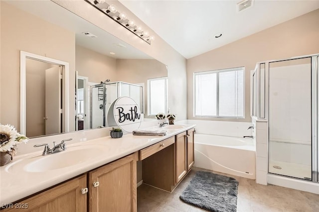 3539 Barrel Bronco Ct, North Las Vegas, NV 89032 - bathroom with double vanity, a stall shower, a bath, lofted ceiling, and tile patterned floors