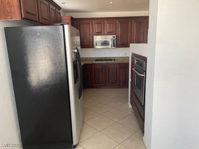 15 E Agate Ave Unit 202, Las Vegas, NV 89123 - kitchen with stainless steel appliances, light tile patterned flooring, and recessed lighting