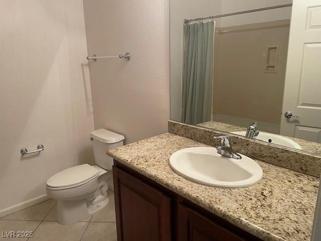 15 E Agate Ave Unit 202, Las Vegas, NV 89123 - full bath with vanity, tile patterned floors, toilet, curtained shower, and baseboards