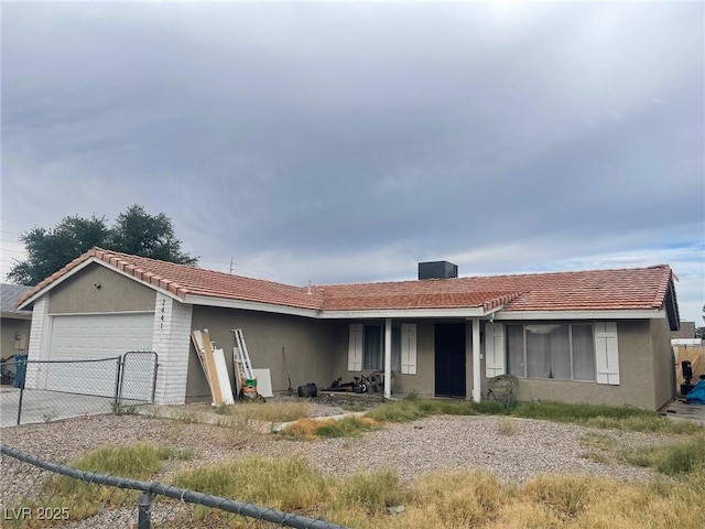 2441 Oak Glen Way, Las Vegas, NV 89115 - ranch-style home with a garage, stucco siding, a tile roof, and concrete driveway