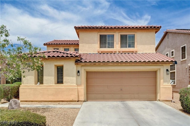 4308 Desert Haven Ave, North Las Vegas, NV 89085 - mediterranean / spanish home with driveway, an attached garage, a tiled roof, and stucco siding
